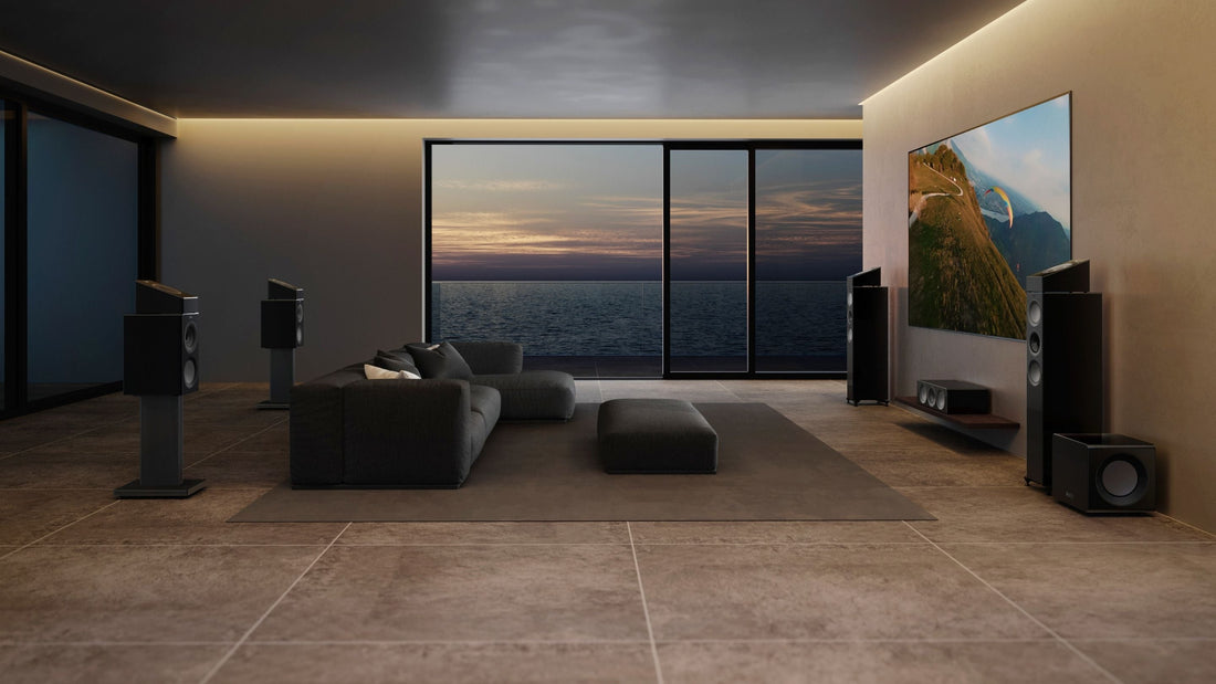 KEF soundbar positioned beneath a wall-mounted TV in a modern living room for an immersive home cinema experience