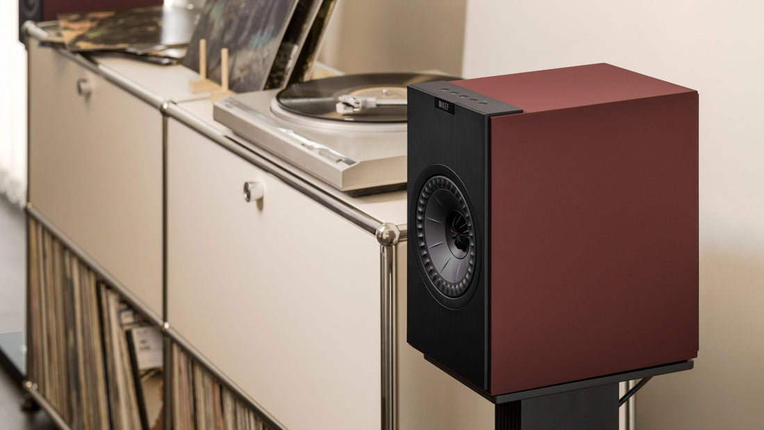 Close up of KEF Coda W wireless speaker mounted to a floor stand 