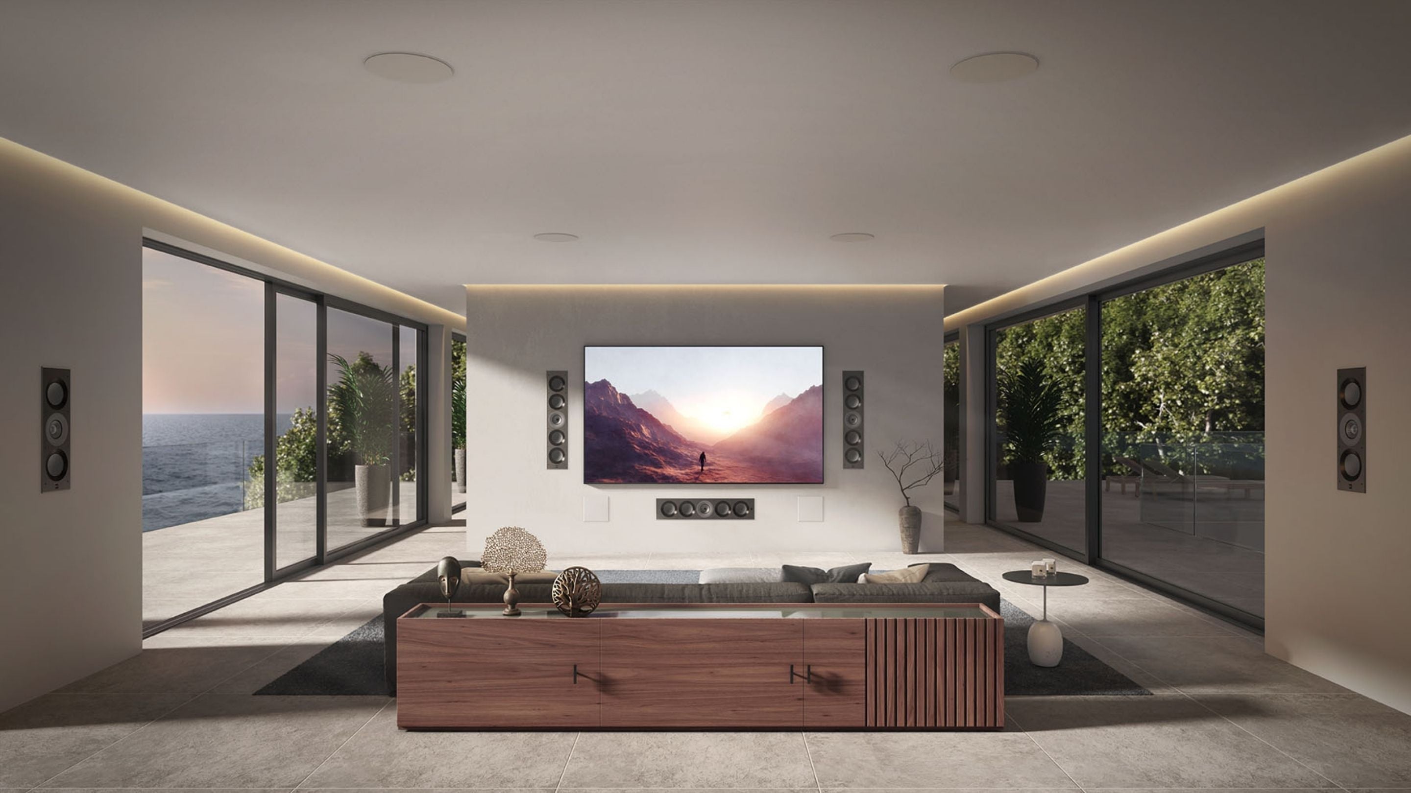 Modern living room featuring KEF In-Wall speakers Ci-Reference and a large wall-mounted TV.