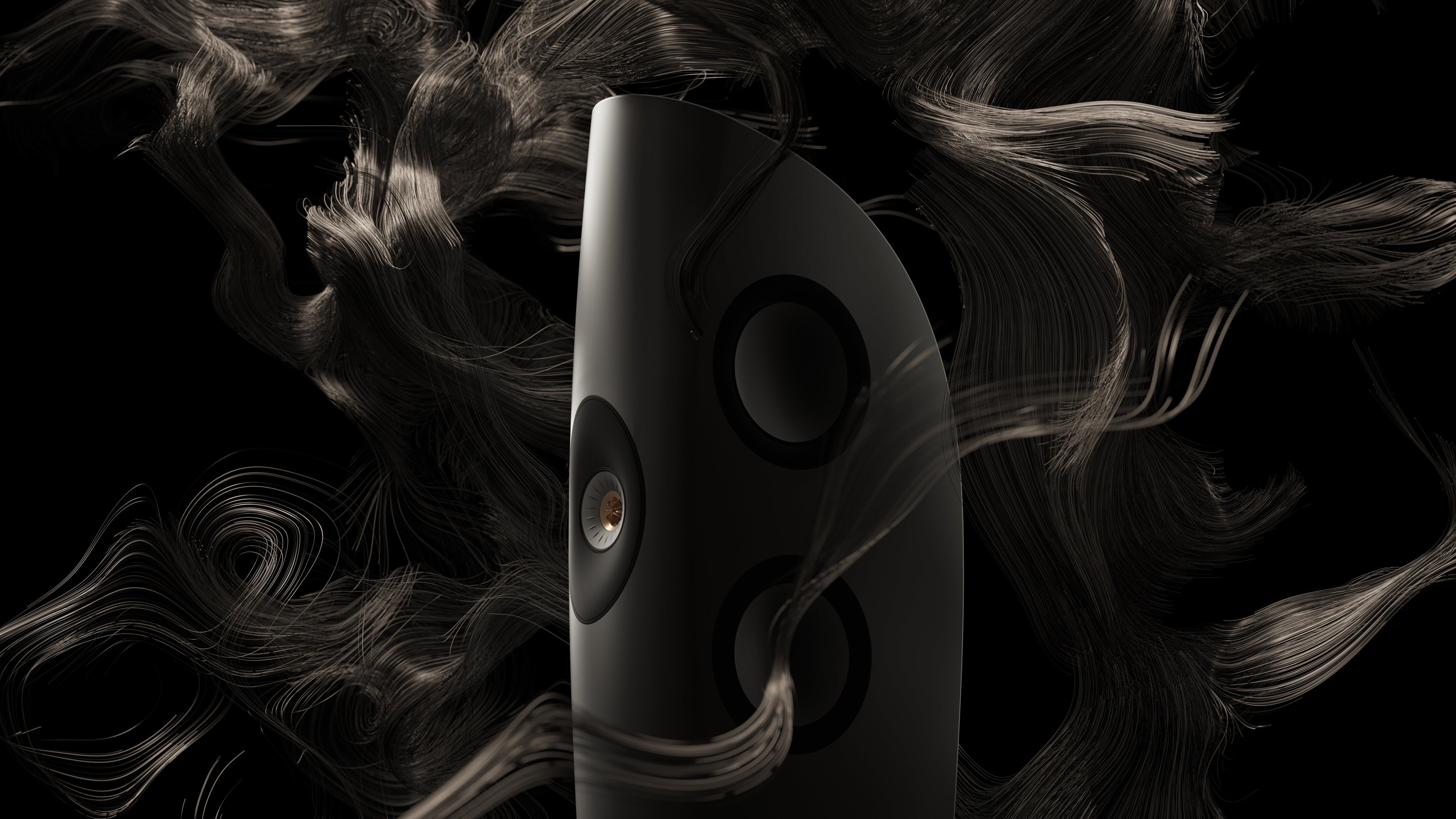 Black KEF Blade speaker with abstract black and gray background.